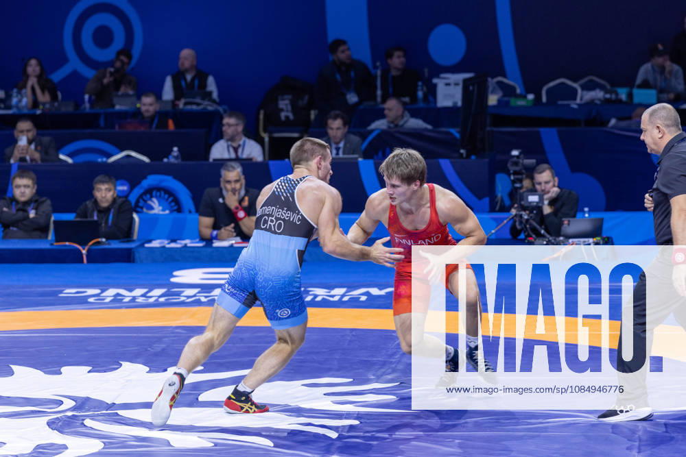 Astana, 2021 World Wrestling Championshi, Kazakhstan: Finland s Jonni Kunnari Sarkkinen red competes against Croatia s Antonio Kamenjasevic blue in the men s Greco-Roman 77kg competition at the Senior World Wrestling Championships in Astana, Kazakhstan, on October 24, 2026. Sarkkinen won the bout 7-2. . Astana Kazakhstan - ZUMAt172 20261024_zip_t172_005