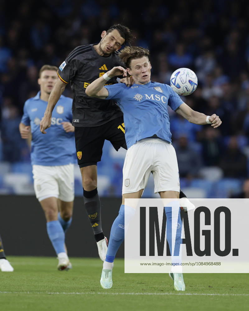 Italy: Serie a football match SSC Napoli vs AS Roma Romas Dutch midfielder Marten de Roon challenges for the ball with Napoli s Scottish midfielder Scott McTominay during the Serie A football match between SSC Napoli and AS Roma at the Diego Armando Maradona Stadium in Naples, October 24, 2026. _BPH5068