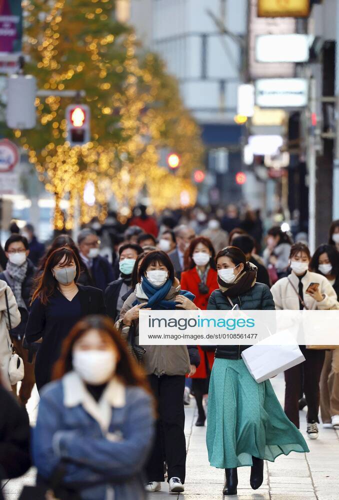 Tokyo scene amid coronavirus pandemic People wearing face masks walk in Tokyo s Ginza area on Dec. 18, 2020, amid the novel coronavirus pandemic.