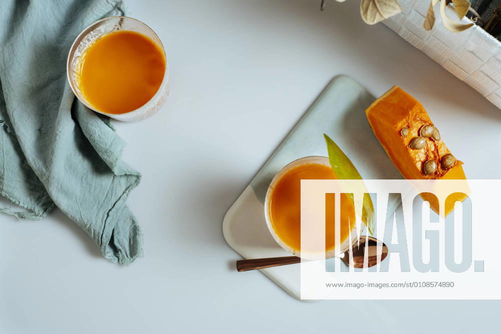 Mango and pumping smoothie on a glass. Surrounded by fruits and vegetables, healthy life concept, Model released, Property released