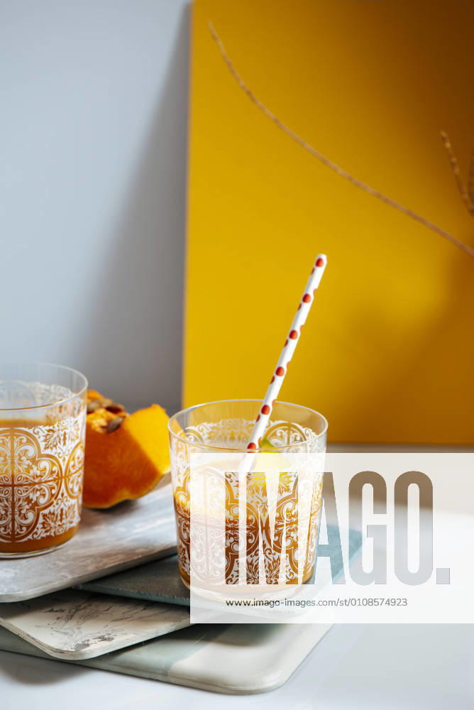 Mango and pumping smoothie on a glass. Surrounded by fruits and vegetables, healthy life concept, Model released, Property released
