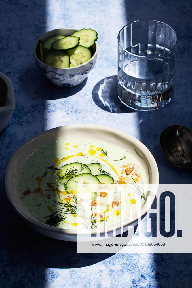 From above cold cucumber and dill soup named Tarator on rustic table with shadow