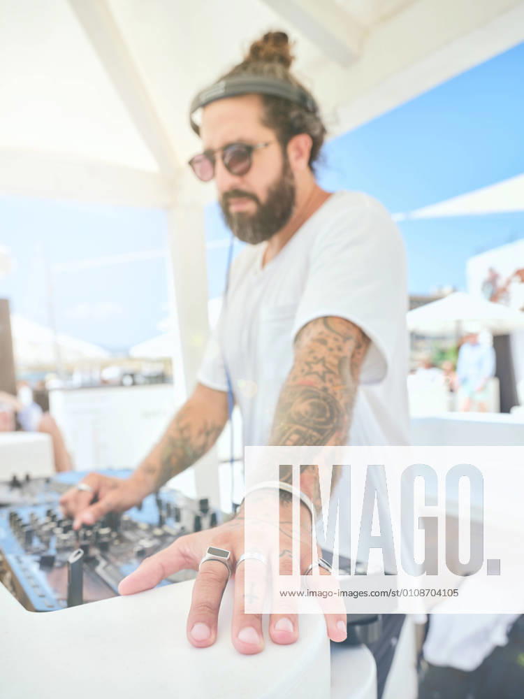 DJ playing music at party, Model released