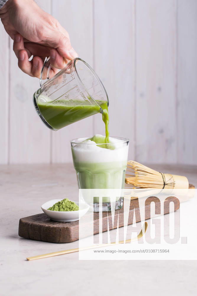 Preparing matcha latte beverage