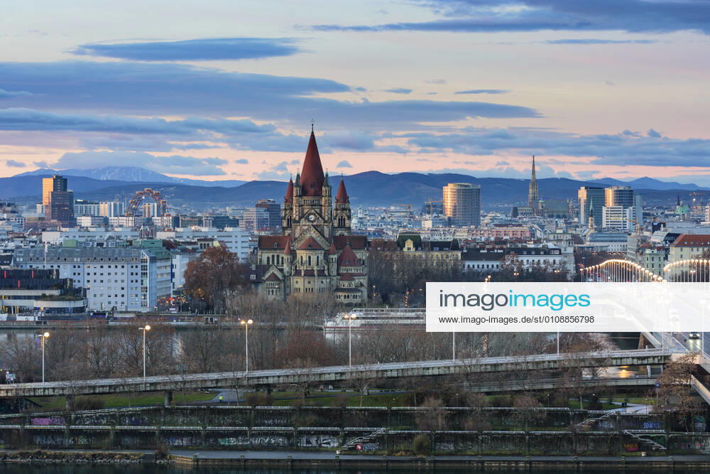 Vienna city center, river Donau (Danube), bridge Reichsbrücke, church Franz von Assisi, cathedral Stephansdom (St. Stephen s Cathedral), Ferris Wheel in Prater, mountain Schneeberg (left) Wien, Vienna Wien Austria 00. overview