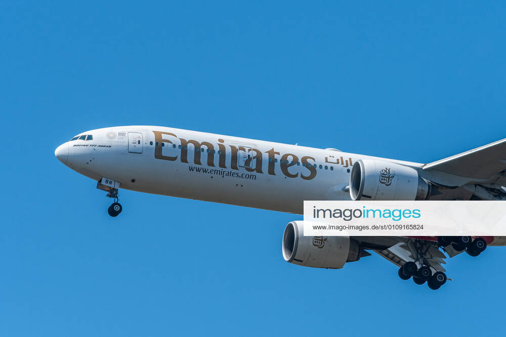 Airplane on landing approach on a sunny day in spring, blue sky, sunny day in spring Donaustadt Austria