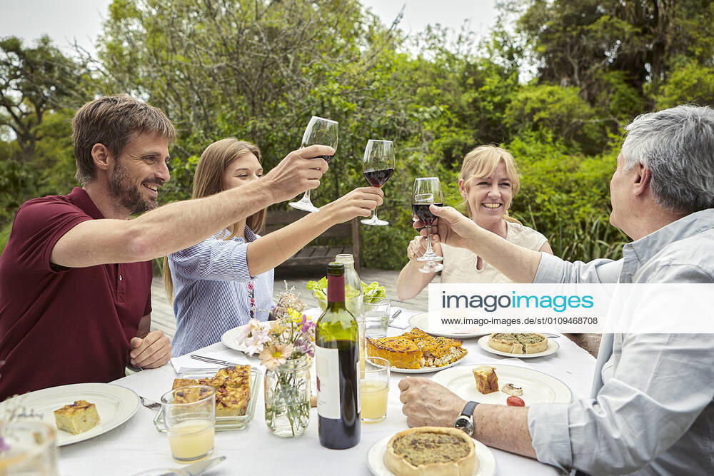 Happy family toasting wine glasses