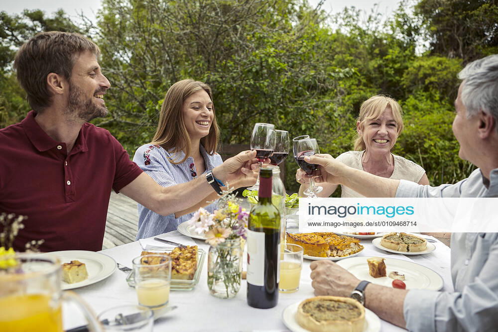 Happy family toasting wine glasses