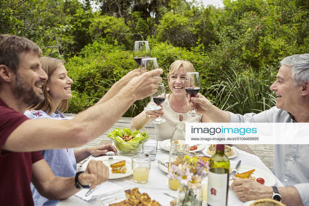 Happy family toasting wine glasses