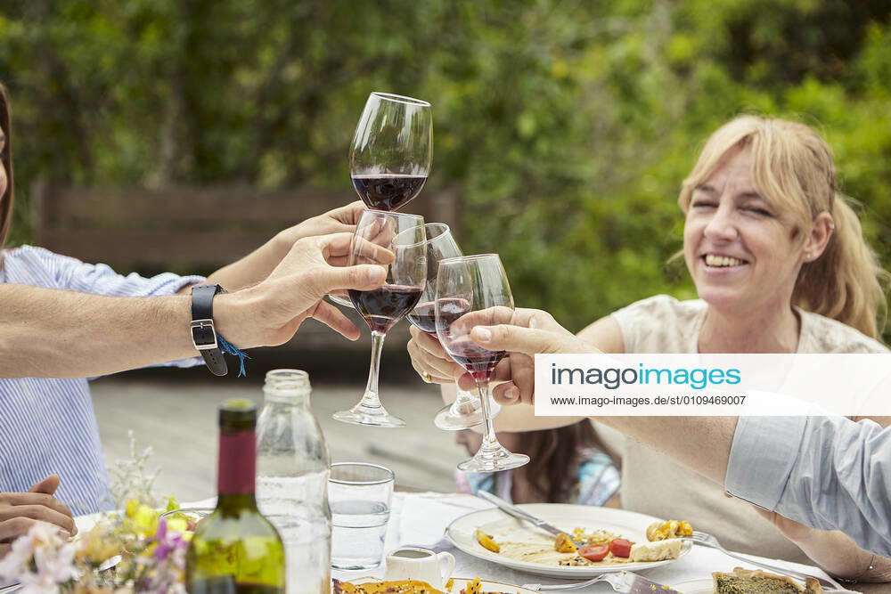 Happy family toasting wine glasses