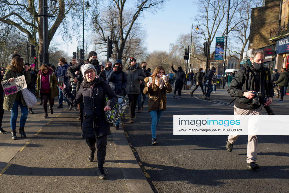 Metropolitan police officers swarmed Clapham Common in on Saturday after anti-lockdown protesters gathered in the area. Group of demonstrators chanting â€oetake your freedom back†walked along the high street. Few demonstrators was arrested by Metropolitan Police officers. England s third national lockdown has legally come into force last week. The lockdown means people are able to leave their homes for limited reasons, with measures expected to stay in place until mid-February. London UK - ZUMAg173 20210109_zap_g173_009