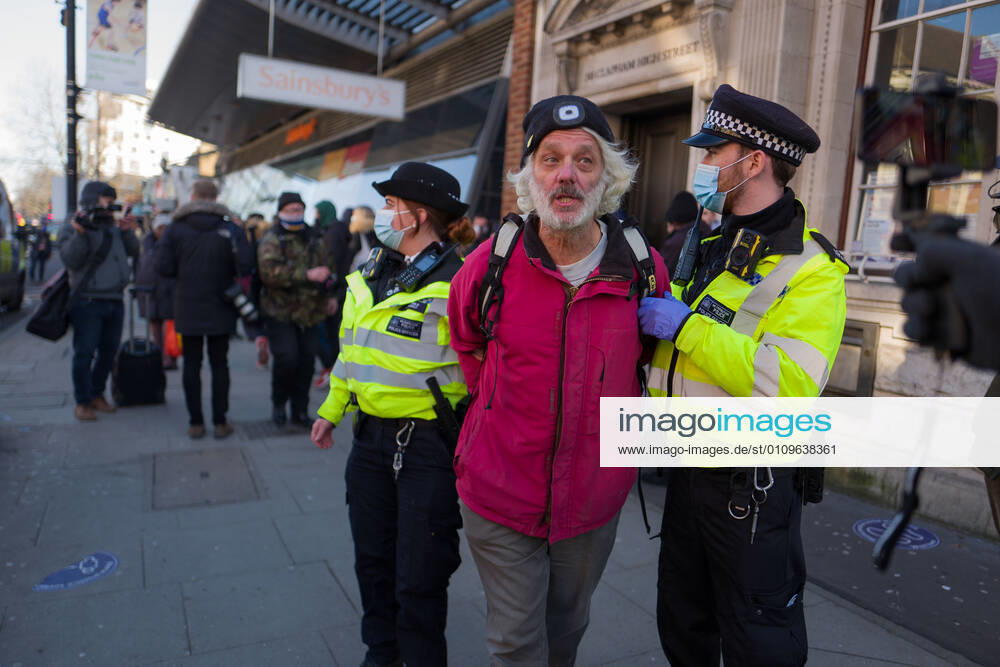 Man was arrested and taken to a police van in Clapham Common London UK - ZUMAg173 20210109_zap_g173_019