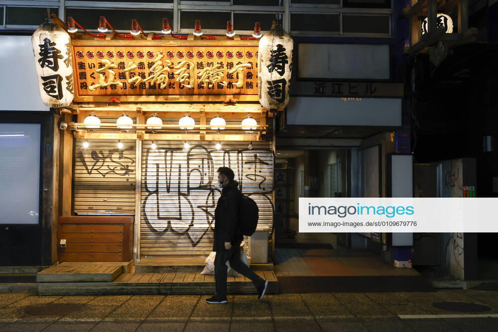 A man wearing a face mask leaves Kabukicho (the red-light district of Tokyo) after the establishments closed at 8 pm to stop the COVID-19 infections in the capital. Tokyo reported 1,494 new COVID-19 cases on January 10; following four days of over 2,000 cases, the daily infections count dropped for the first time after the state of emergency was declared in Tokyo, Kanagawa, Saitama, and Chiba prefectures. Tokyo Japan - ZUMAm191 20210110_zap_m191_023