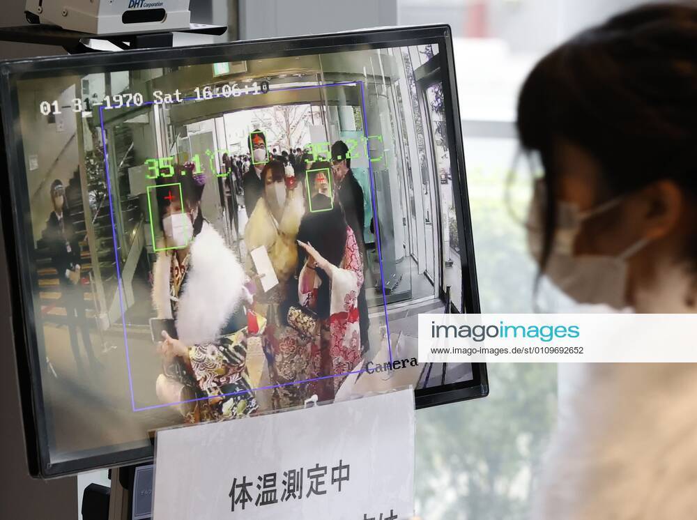 Coming-of-age ceremony under virus state of emergency A woman has her temperature checked before entering the venue of a coming-of-age ceremony in Tokyo s Suginami Ward on Jan. 11, 2021, as the capital is under a coronavirus state of emergency.