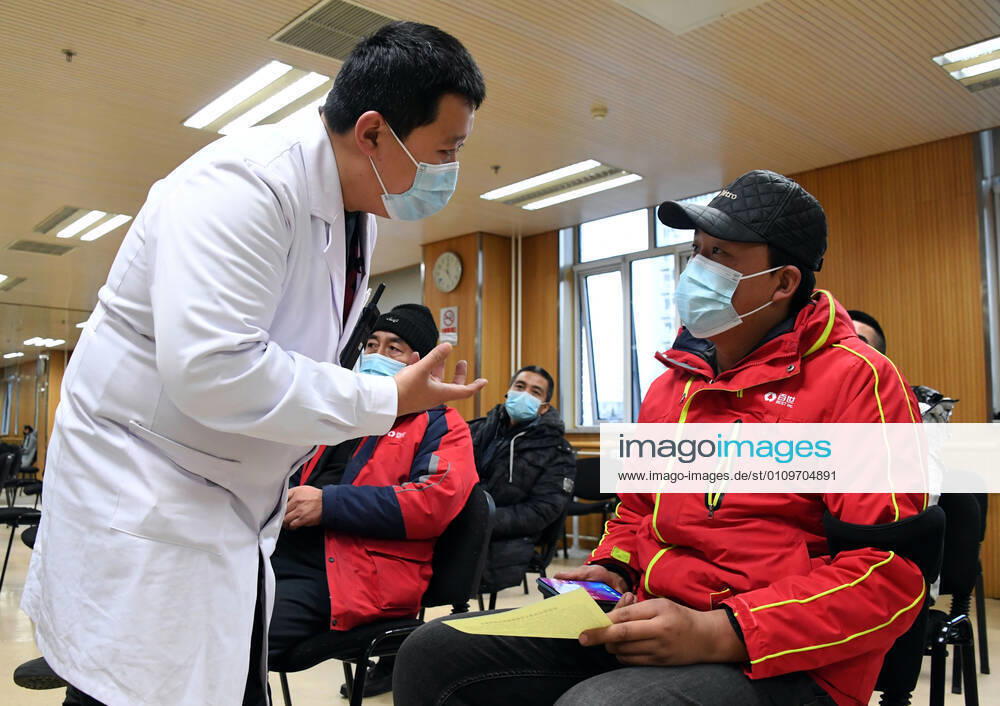 (210111) -- BEIJING, Jan. 11, 2021 -- A medical worker (1st L) inquires a recipient of his physical condition after receiving a COVID-19 vaccine shot at a temporary inoculation site in Haidian District in Beijing, capital of China, Jan. 11, 2021. Over 1 million people in Beijing had received the first dose of COVID-19 vaccine as of 11 a.m. Monday, the municipal health commission said. TO GO WITH Over 1 mln get COVID-19 vaccine in Beijing ) CHINA-BEIJING-COVID-19 VACCINE-1 MILLION-INOCULATIONS (CN) RenxChao