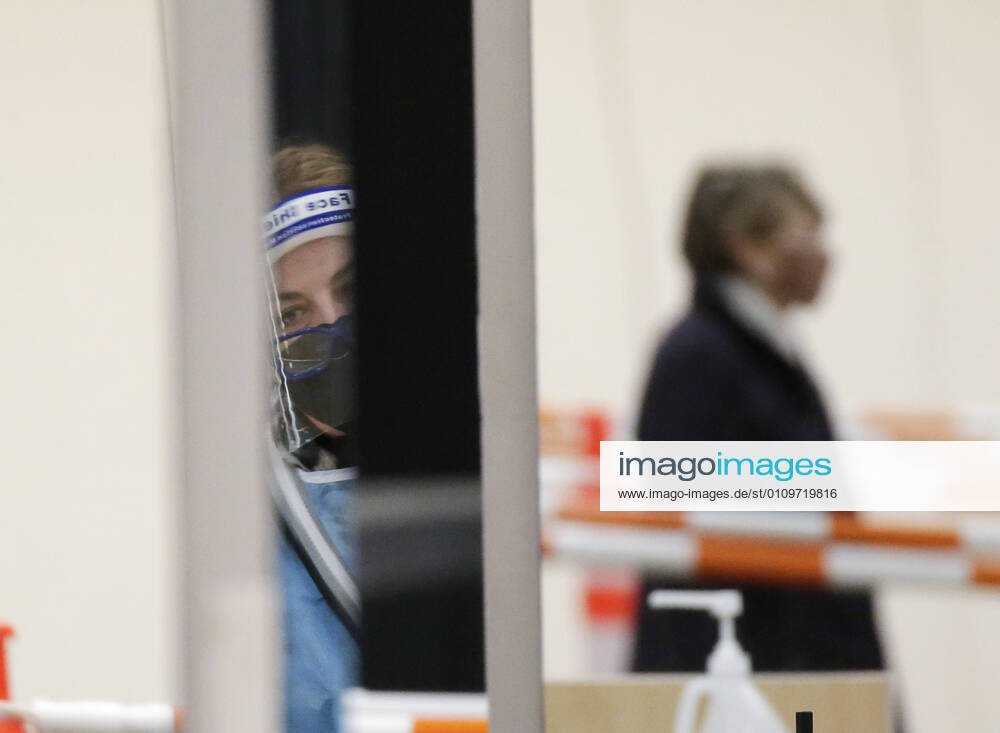 People arrive and get checked in to receive a coronavirus vaccine at an Essex County COVID-19 Vaccination Site located at a closed Sears retail store in the Livingston Mall in Livingston, New Jersey on Monday, January 11, 2021. Public health agencies and health-care groups are using the retailer s empty stores to deliver Vaccines in several locations around parts of the United States. NYP20210111109 JohnxAngelillo
