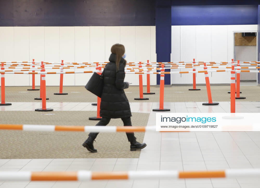 People arrive and get checked in to receive a coronavirus vaccine at an Essex County COVID-19 Vaccination Site located at a closed Sears retail store in the Livingston Mall in Livingston, New Jersey on Monday, January 11, 2021. Public health agencies and health-care groups are using the retailer s empty stores to deliver Vaccines in several locations around parts of the United States. NYP20210111118 JohnxAngelillo