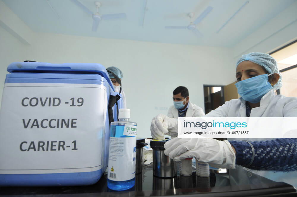 A health worker seen next to a vaccine carrier during a dry-run of Covid-19 vaccine at Bhangel CHC hospital, on January 11, 2021 in Noida, India. Prime Minister Narendra Modi on Monday spoke on India s vaccination plan ahead of the mega Covid-19 vaccination drive, which is set to start on 16 January, 2021. Around 3 crore healthcare workers and frontline workers will be vaccinated in the first phase of vaccination. In the 2nd phase, those above 50 years and those under 50 years with co-morbid conditions will be vaccinated, the Prime Minister said. (Photo by Sunil Ghosh Hindustan Times) Covid-19 Vaccine Dry Run