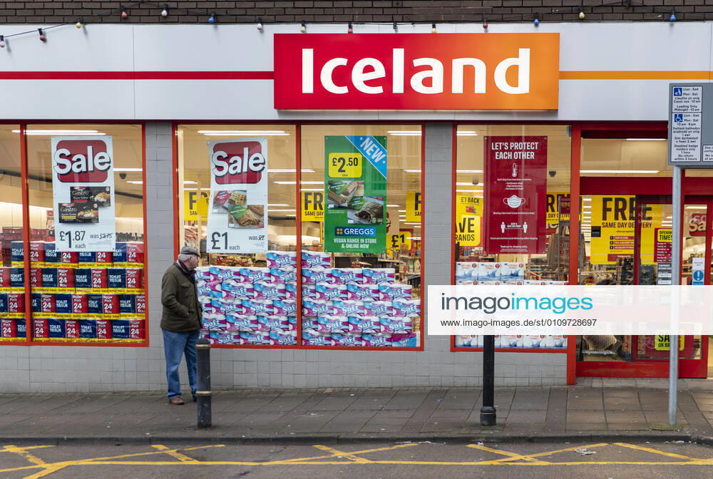 A man walks past the Iceland supermarket in Wales. Newport United Kingdom - ZUMAs197 20210111_zab_s197_011
