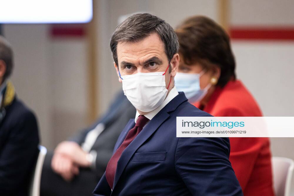 - French Health Minister Olivier Veran listen to French Prime Minister as he addresses a press conference in Paris on January 14, 2021, on the current French government strategy for the ongoing coronavirus (Covid-19) epidemic.