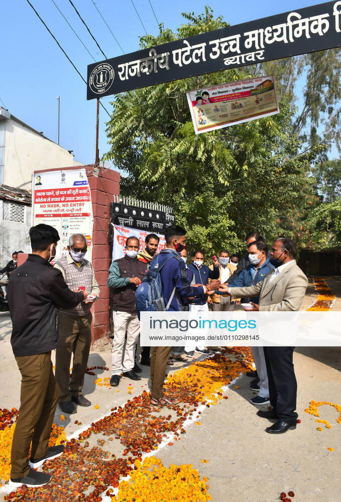 India: Teachers welcome students after schools reopen in Rajasthan Students greeted by teachers as they arrive to attend classes at a government school that was reopened after remaining closed for 309 days due to COVID-19 pandemic in Beawar. Beawar Rajasthan India