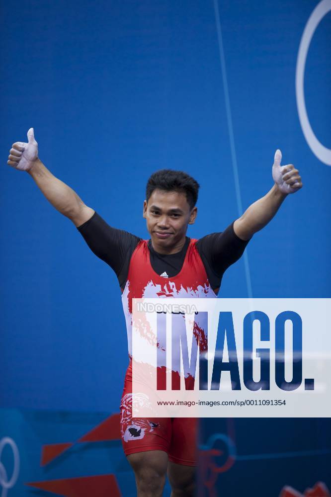 London, England, United Kingdom - EKO YULI IRAWAN (INA) celebrates completing a lift in the men s 62kg weightlifting competition at ExCeL in London. EKO won an Olympic Bronzemedal. Olympics 2012 - Weightlifting - ZUMAw10