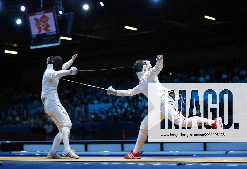 London, England, United Kingdom - Great Britain s Corinna Lawrence (right) set up a last-32 contest with European champion Simona Gherman in the women s Epee with a win over Caterin Bravo Aranguiz. (left) .BRIAN PETERSON¢, England - 07 29 2012 Olympics 2012 - London - July 30, 2012 - ZUMAm42