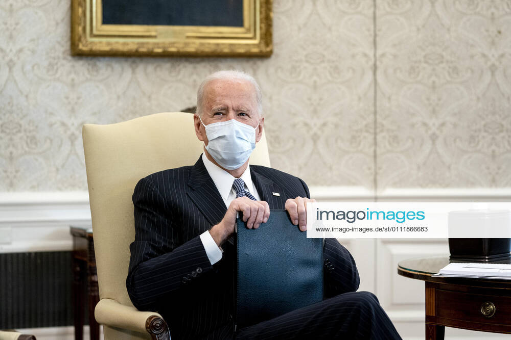 President Joe Biden wears a protective mask during a meeting with Democratic Senators to discuss the American Rescue Plan in the Oval Office of the White House in Washington on Wednesday, February 3, 2021 Washington USA - ZUMAs152 20210203_zaa_s152_240
