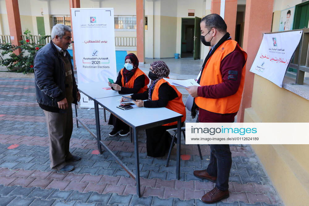 Khan Yunis, Gaza Strip, Palestinian Territory: Palestinian members of Central Elections Commission register voters for the upcoming elections, in a school, in Khan Yunis in the southern Gaza Strip on February 10, 2021. Rival Palestinian factions Fatah and Hamas said they had agreed on mechanisms for forthcoming elections and to respect their outcome, after years of bitter divisions. The parliamentary and presidential polls are set for May 22 and July 31, respectively Khan Yunis Palestinian Territory - ZUMAap3_ 20210210_zaf_ap3_001