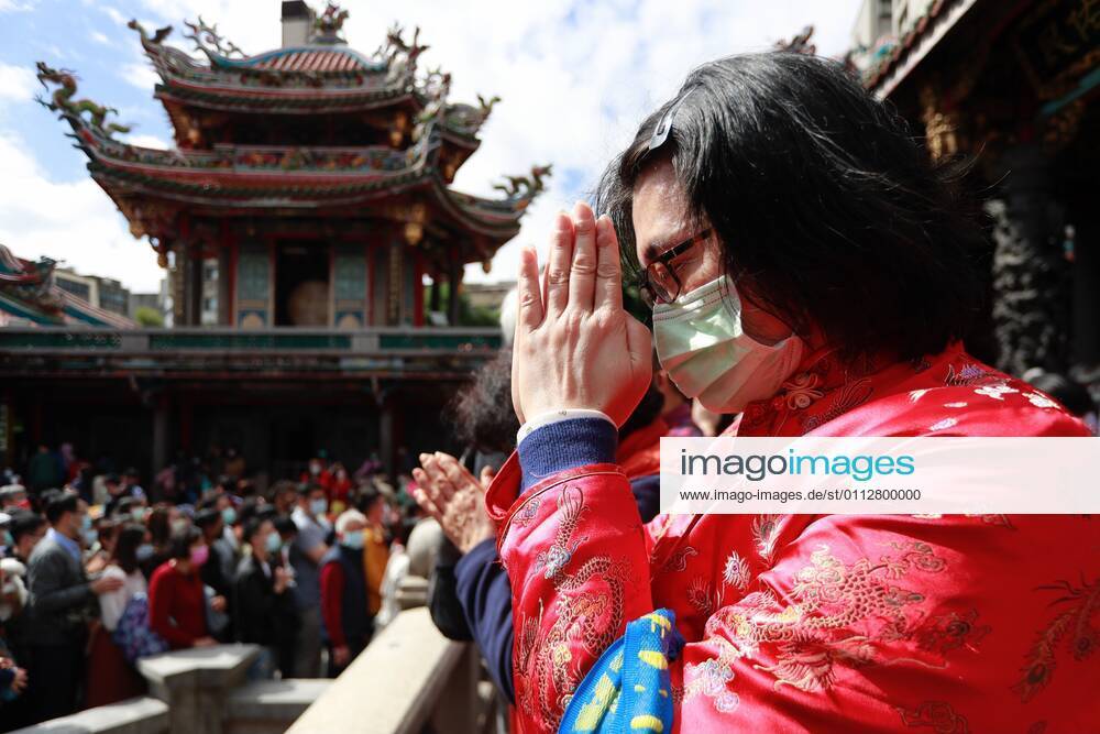 A Taiwanese wearing a mask pays worships at Lungshan Temple that was build during the World War II, as the Year of the Ox has come alongside the Lunar New Year Festival, amidst the Covid-19 pandemic. The islandâ€⠢s authority has put large gatherings, activities for festival celebration in cancellation or suspension due to a domestic outbreak. Taipei Taiwan - ZUMAs313 20210212_zip_s313_003