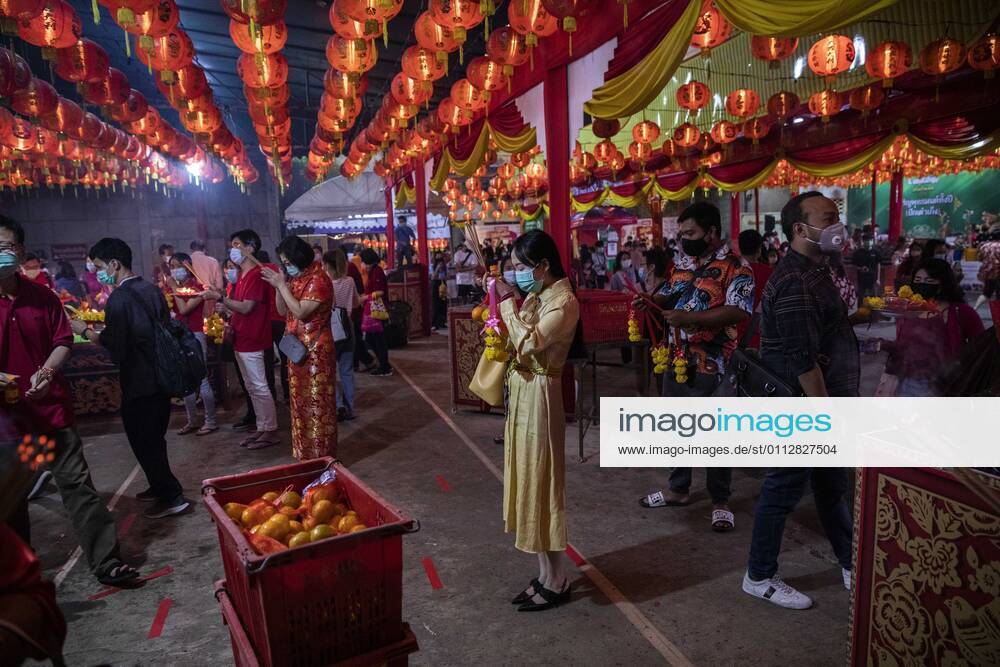 People pray at Wat Mangkon in Chinatown during Chinese New Year celebrations in Bangkok, Thailand, on Sunday, February 12, 2021, in Bangkok, Thailand. Thailand - ZUMAm249 20210212_zip_m249_012