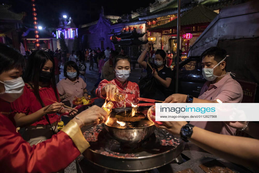 People pray at Wat Mangkon in Chinatown during Chinese New Year celebrations in Bangkok, Thailand, on Sunday, February 12, 2021, in Bangkok, Thailand. Thailand - ZUMAm249 20210212_zip_m249_014
