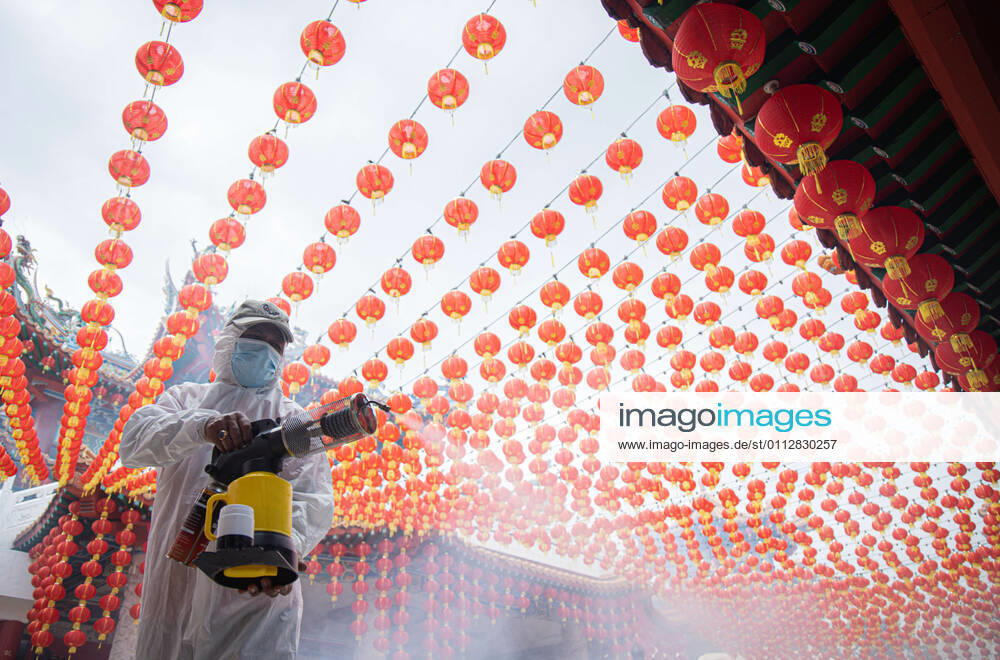 A healthcare worker dressed in a protective suit sprays disinfectants at the Thean Hou Temple during the Lunar New Year. Kuala Lumpur Malaysia - ZUMAs197 20210212_zaa_s197_102