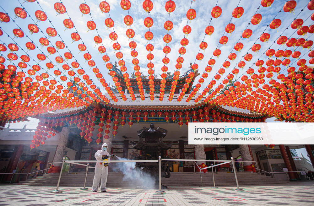 A healthcare worker dressed in a protective suit sprays disinfectants at the Thean Hou Temple during the Lunar New Year. Kuala Lumpur Malaysia - ZUMAs197 20210212_zaa_s197_104