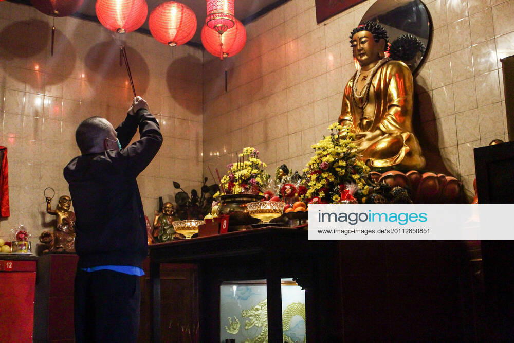 A man prays at the Dharma Ramsi Temple during the Lunar New Year celebrations. The Lunar New Year, also known as Spring Festival, falls on 12 February 2021, marking the beginning of the Year of the Ox. Bandung Indonesia - ZUMAs197 20210212_zaa_s197_073
