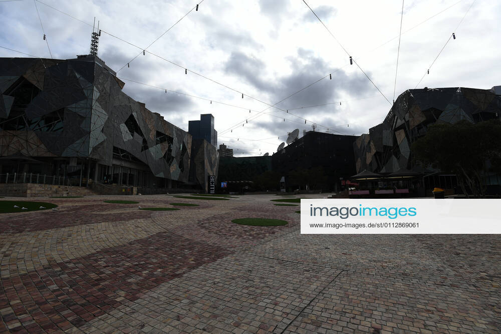 VICTORIA CORONAVIRUS COVID19, An empty Federation Square is seen in Melbourne, Saturday, February 13, 2021. Victoria has entered a short, sharp circuit-breaker lockdown for five days amid fears the highly infectious UK strain of coronavirus has spread in the community. ( NO ARCHIVING, , NO USE IN BOOKS WITHOUT CONSENT MELBOURNE VIC AUSTRALIA