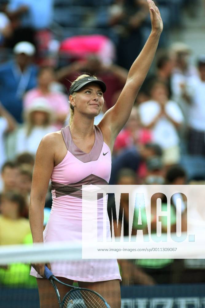 Maria Sharapova of Russia waves to the cheering crowd in the second set during first-round action at the U.S. Open held at the National Tennis Center on August 27, 2012 in New York. NYP20120827329