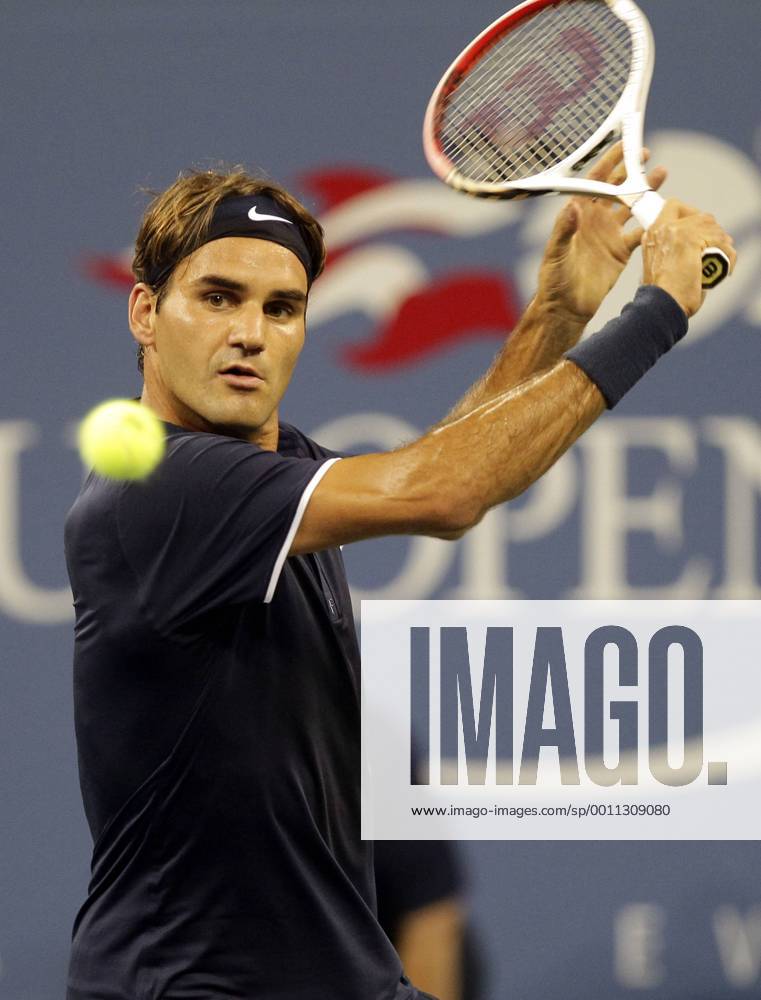 Roger Federer of Switzerland hits a backhand in the first set of his first round match at the 2012 U.S. Open Tennis Championships in Arthur Ashe Stadium at the Billie Jean King National Tennis Center in New York City on August 27, 2012. NYP20120827131