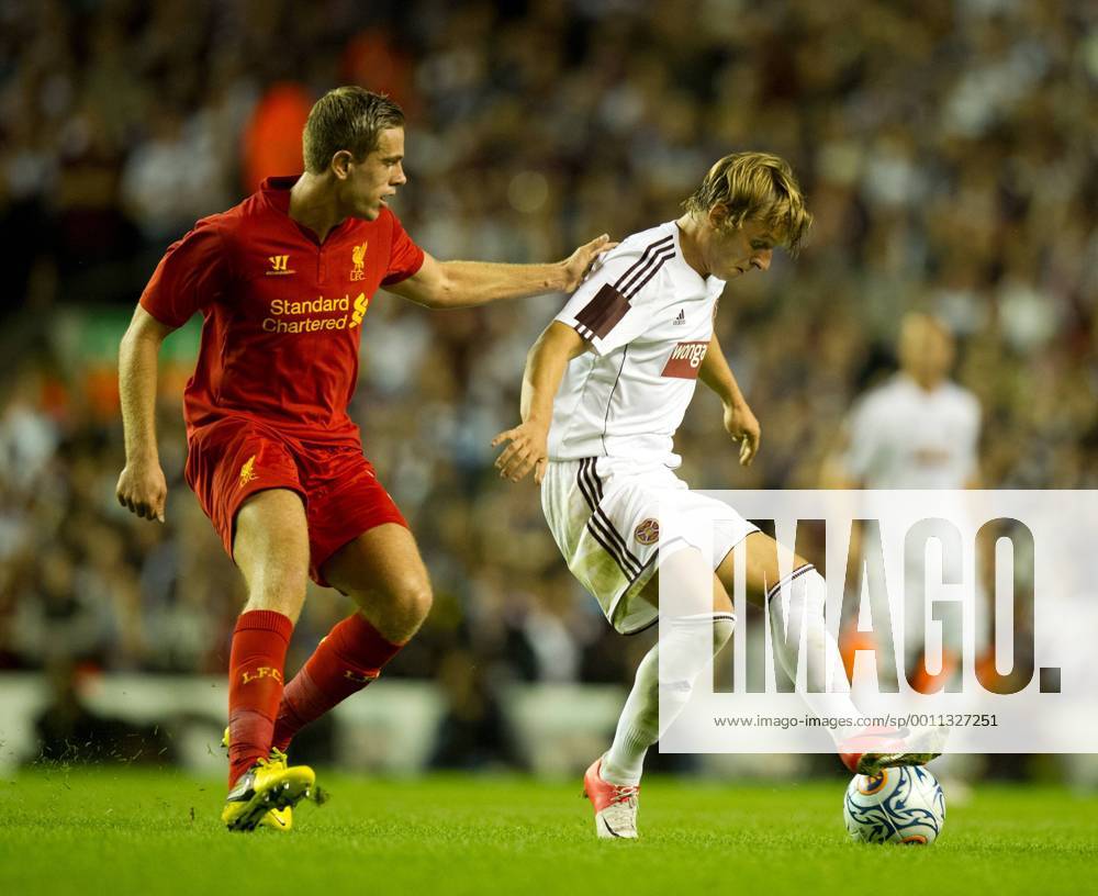 Jordan Henderson of Liverpool tussles with Atvydas Novikovas of Hearts.Europa League qualifying play off, second leg.Liverpool FC - Hearts of Midlothian at Anfield, Liverpool on the 30th August 2012..