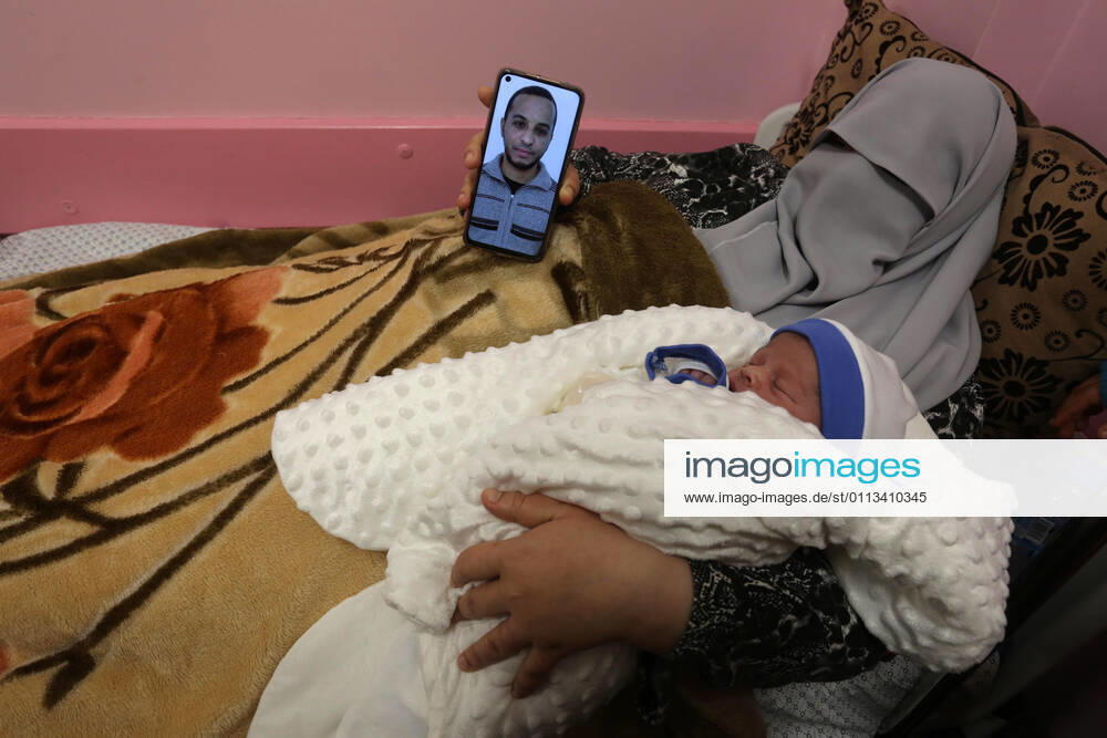 khan Younis, Gaza Strip, Palestinian Territory: The wife of the Palestinian prisoner Mohammad al-Qudra, holds her newborn baby, from whom she conceived with sperm smuggled out of an Israeli prison, at Nasser Medical Complex in khan Younis in the southern of Gaza strip on February 18, 2021. Since 2004, Palestinian security prisoners, who are denied conjugal visitations by their wives, have tried to smuggle their sperm out of Israeli prisons, so that their wives can be inseminated in fertility clinics in the West Bank and Ghazza, and bear them children khan Younis Palestinian Territory - ZUMAap3_ 20210218_zaf_ap3_193
