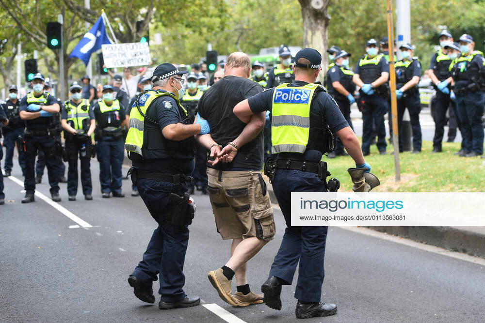 ANTI VACCINATION RALLY MELBOURNE, Police arrest a protester during an anti-vaccination rally in Melbourne, Saturday, February 20, 2021. The national rollout of the Pfizer vaccine will begin on Monday in what will be the largest exercise of its kind in Australia s history. ( NO ARCHIVING, , NO USE IN BOOKS WITHOUT CONSENT MELBOURNE VIC AUSTRALIA