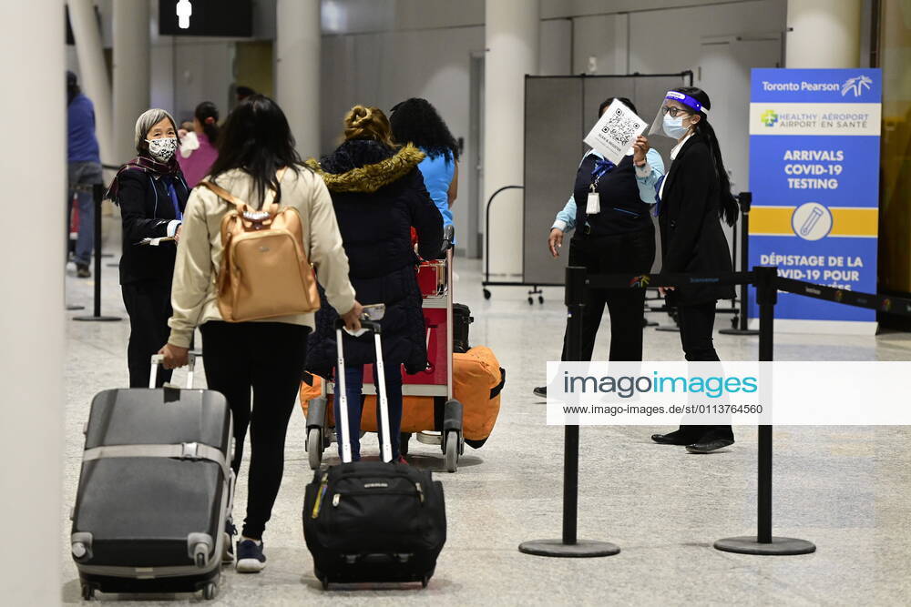 Travellers, who are not affected by new quarantine rules, arrive at Terminal 3 at Pearson Airport in Toronto early Monday, February 22, 2021. Prime Minister Justin Trudeau announced that all travellers entering Canada by air would have to quarantine in a hotel for three days at their own expense starting later today. Toronto Canada - ZUMAc35_ 20210222_zaf_c35_001