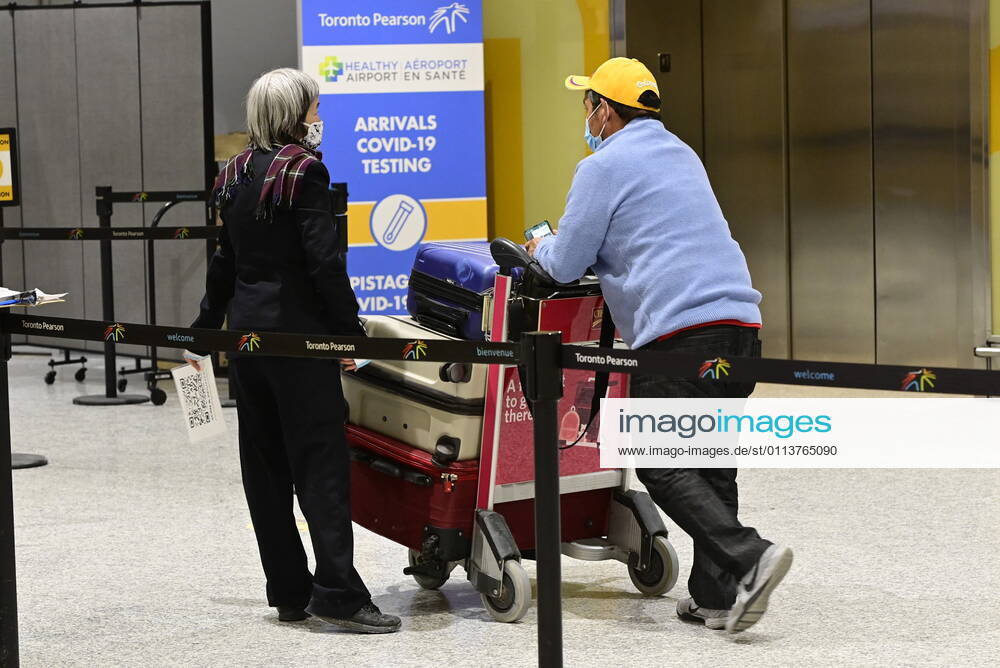 Travellers, who are not affected by new quarantine rules, arrive at Terminal 3 at Pearson Airport in Toronto early Monday, February 22, 2021. Prime Minister Justin Trudeau announced that all travellers entering Canada by air would have to quarantine in a hotel for three days at their own expense starting later today. Toronto Canada - ZUMAc35_ 20210222_zaf_c35_005