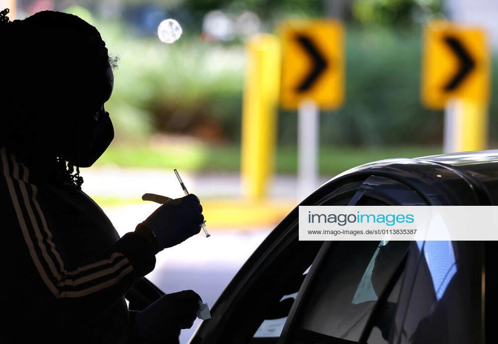A Florida resident gets vaccinated at the drive-thru site at the Orange County Convention Center in Orlando, Monday, February 22, 2021. The Florida Department of Health continues to administer COVID-19 vaccinations at the convention center s North Concourse. Additional FEMA vaccination sites will open starting next week in Orlando and two other Florida cities. Orlando USA - ZUMAm67_ 20210222_zaf_m67_012