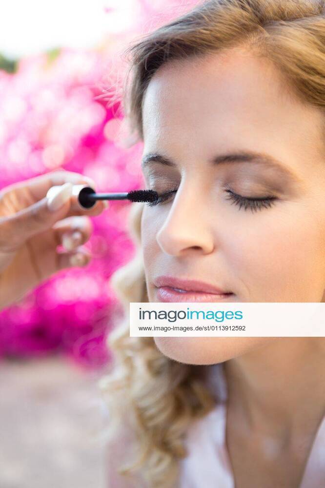 Cropped hand of woman applying mascara to bride Cropped hand of woman applying mascara to bride at yard, model released, , property released, Cape Town, South Africa, 02.05.2017, 1086147.jpg, cropped, hand, applying, mascara, bride, yard, holding, cosmetic, makeup, eyelash, mascara wand, putting, eye makeup, beautiful, celebration, celebration event, ceremony, christianity, life events, lifestyle, religion, tradition, traditional culture, wedding, wedding ceremony, pretty, attractive, marriage, confidence, assistance, getting dressed, preparation, bridesmaid, together, bonding, eyes closed, makeup brush, putting on, face 20s, Young Adult, Woman, Female, Caucasian, Black, 25-29 Years, Young Women, Caucasian Ethnicity, 20-24 Years, African E