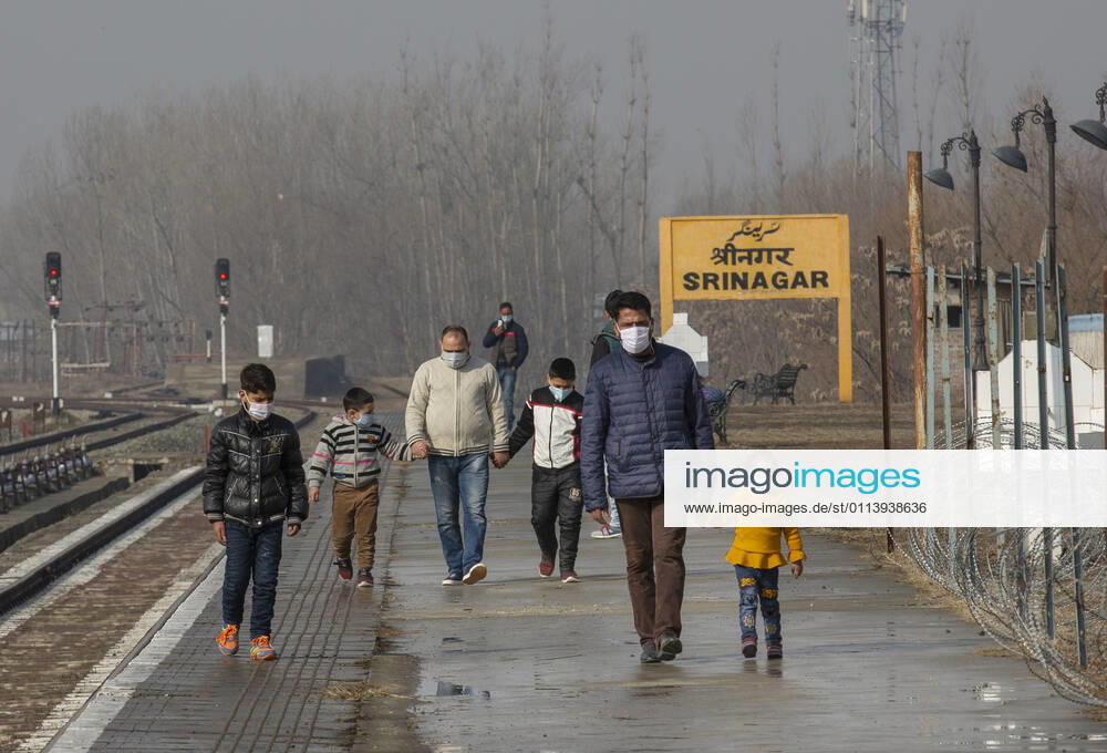 (210223) -- SRINAGAR, Feb. 23, 2021 -- Passengers wearing face masks walk on a railway platform in Srinagar city, the summer capital of Indian-controlled Kashmir, Feb. 23, 2021. Train service was resumed partially in Indian-controlled Kashmir after a gap of 11 months, officials said Tuesday. The service was suspended on March 19 last year owing to the outbreak of the COVID-19 pandemic. ) KASHMIR-TRAIN SERVICE-RESUMPTION JavedxDar