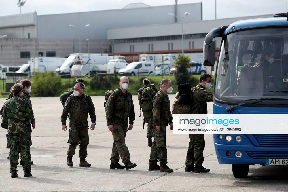 German army medical experts get into a in a bus at Figo Maduro military airbase in Lisbon, Portugal on February 23, 2021. Based on a bilateral agreement, a second team of German army medical experts arrived in Portugal on Tuesday to replace the team that has been in Portugal since February 3 to assist the country in its fight against the COVID-19 pandemic. Lisbon Portugal - ZUMAf123 20210223_zap_f123_009