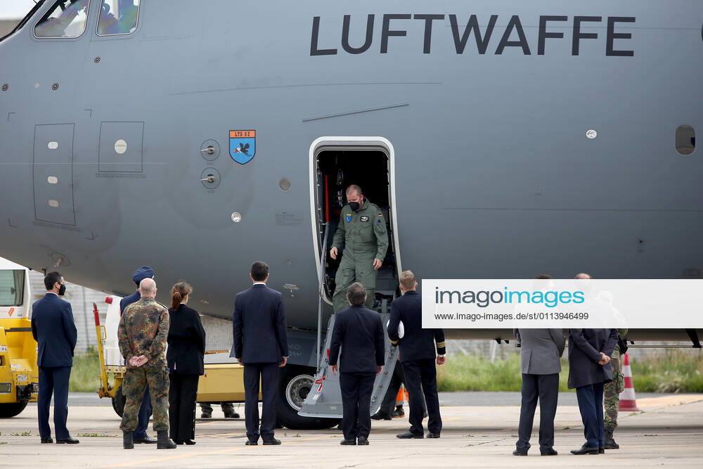 Portuguese officials welcome German army medical experts at Figo Maduro military airbase in Lisbon, Portugal on February 23, 2021. Based on a bilateral agreement, a second team of German army medical experts arrived in Portugal on Tuesday to replace the team that has been in Portugal since February 3 to assist the country in its fight against the COVID-19 pandemic. Lisbon Portugal - ZUMAf123 20210223_zap_f123_015
