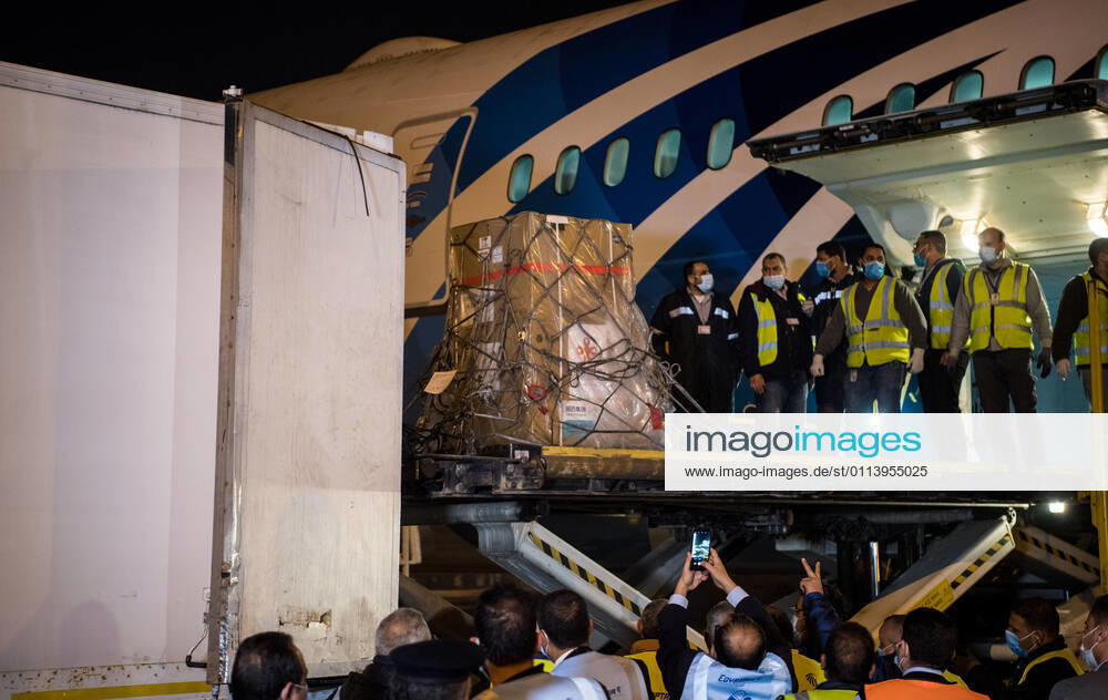 (210223) -- CAIRO, Feb. 23, 2021 -- Workers upload a batch of China s Sinopharm COVID-19 vaccines onto a truck in Cairo International Airport, Egypt, Feb. 23, 2021. The shipment of COVID-19 vaccines from Chinese company Sinopharm arrived in Egyptian capital Cairo on Tuesday. ) EGYPT-CAIRO-CHINA-VACCINE-ARRIVAL WuxHuiwo