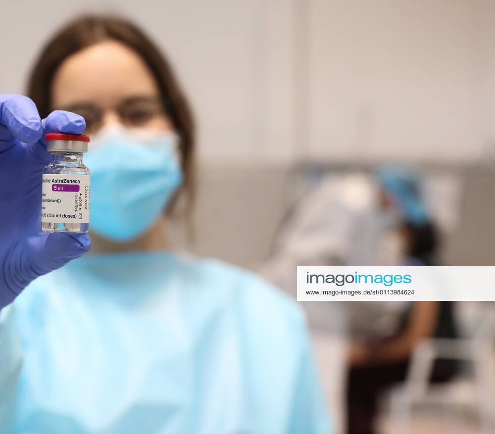 A health professional holds a vial with the vaccine against COVID-19 from AstraZeneca, in the Pavilion 3 of the Public Hospital Enfermera Isabel Zendal, in Madrid, (Spain), on February 23, 2021. This Tuesday begins the vaccination in the pavilion 3 of the hospital with the vaccine of AstraZeneca to 400 people of External Health, AENA, inspectors of Public Health, of Institute of Social Security, professionals of reformatories, Forensic Doctors, Students of CC Health and veterinarians. These new groups to be vaccinated will be joined by those over 80 years of age on Thursday 25 February in the Primary Care centres of each of the health areas of the community with 50,000 doses. 23 FEBRUARY 2021;ISABEL DÃAZ AYUSO;AYUSO;MADRID;COMMUNITY OF MAD